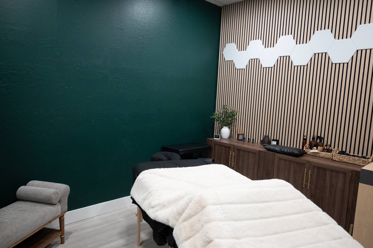 Massage room with wood slat wall